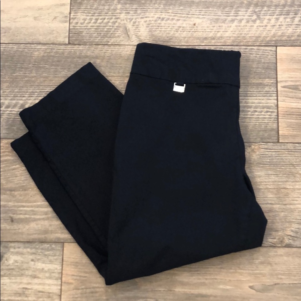 Blue colored tummy-control Capri trouser pants.